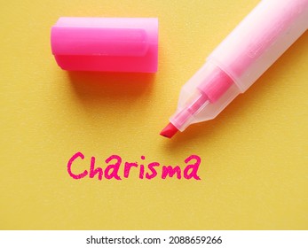 Pink Highlight Pen On Yellow Background With Handwritten Text CHARISMA, Refers To People Who Have Naturally Ability To Influence Others, Magnetic Charm Which Attract Attention And Admiration