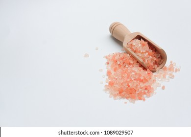 Pink Himalaya Salt Scrub On Spoon And White Background For Spa. Selective Focus Or Blurry.