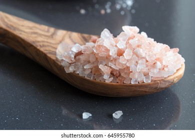 Pink Himalayan Sea Salt On A Wooden Spoon.