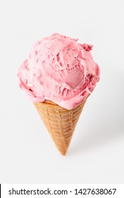 pink ice cream ball in a Waffle Cone on a white Background. Fruit ice cream in a waffle cone.