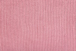 Pink Knitted Fabric Background. Knitted Woolen Fabric Rose Texture. Abstract Wool Sweater Texture Close Up.