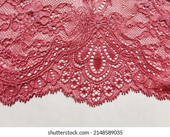 Pink lace border. Delicate fabric element for lingerie or wedding dress, isolated on white background.