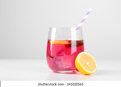 Pink Lemonade In Glass Isolated On White