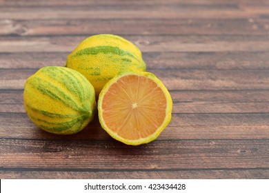 Pink Lemons On Wooden Background