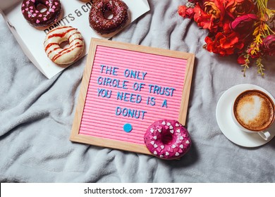 Pink Letter Board With Donuts And Coffe.