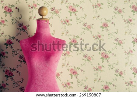 Pink mannequin with flowers background
