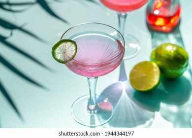 Pink Margarita In A Cocktail Glass With A Slice Of Lime 