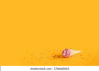 Pink Marshmallows In A Waffle Cone And Caramel Crumbs On A Yellow Background. The Concept Of A Children's Holiday. Selective Focus