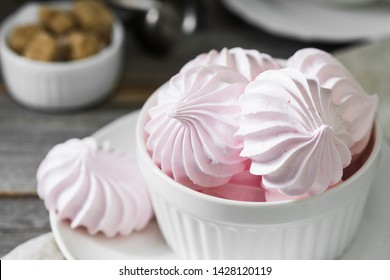 Pink Meringue On The Grey Table. French Dessert