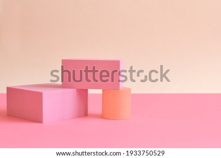 Pink minimalist abstract background with three-dimensional geometric shapes in pastel colors. podiums for goods . Selective focus, space for text