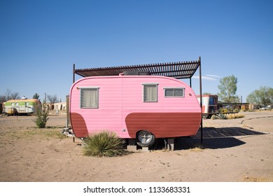 pink mobile home in the desert