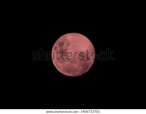 pink moon, observed at night, in the southern\
hemisphere, sao paulo,\
brazil