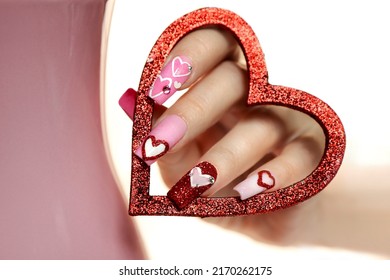 Pink Multicolored Manicure On Long Nails With Hearts.