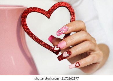 Pink Multicolored Manicure On Long Nails With Hearts.