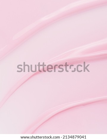 Pink nail polish texture. Light pink cosmetic cream texture. Lotion, skincare background.