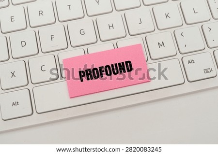 A pink note with the word 