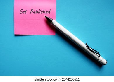 Pink note,pen on copy space blue background with text written GET PUBLISHED, concept of book writer author must get their manuscript to be read by editors and published by publisher or self-publishing
