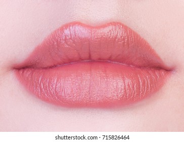 pink nude matte lipstick on lips stock photo