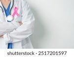 Pink October Breast Cancer Awareness month, woman doctor with pink Ribbon in hospital for support people life and illness. National cancer survivors month, Mother and World cancer day concept