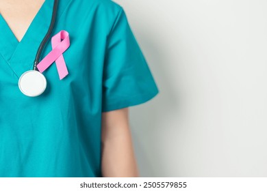 Pink October Breast Cancer Awareness month, woman doctor with pink Ribbon in hospital for support people life and illness. National cancer survivors month, Mother and World cancer day concept - Powered by Shutterstock