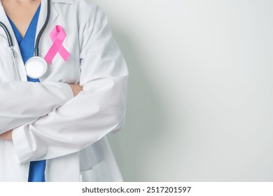 Pink October Breast Cancer Awareness month, woman doctor with pink Ribbon in hospital for support people life and illness. National cancer survivors month, Mother and World cancer day concept