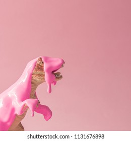 Pink paint dripping on dinosaur toy. Creative minimal concept. - Powered by Shutterstock