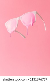 Pink paint dripping out white painted sunglasses  Creative fashion minimal concept 