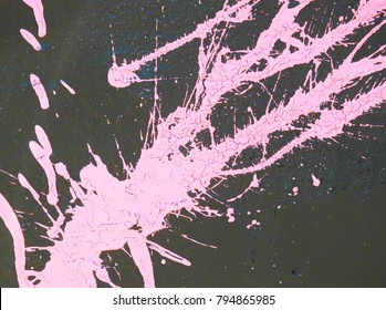 Pink Paint Splashes And Drips On A Grey Wall