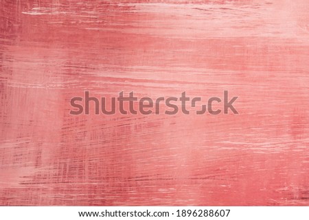 Pink painted distressed wooden backdrop, grunge background or texture with brushstrokes 