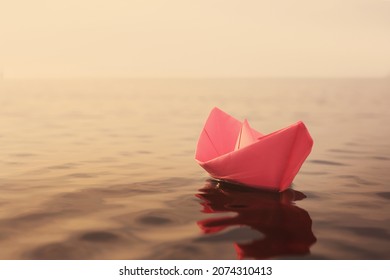 Pink Paper Boat Floating On River. Retro Photo Effect