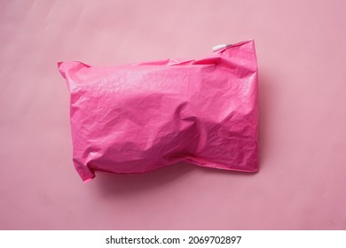 Pink Paper Bubble Envelope On Table 