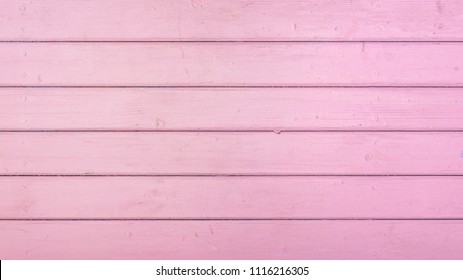 Pink pastel colored wooden planks background