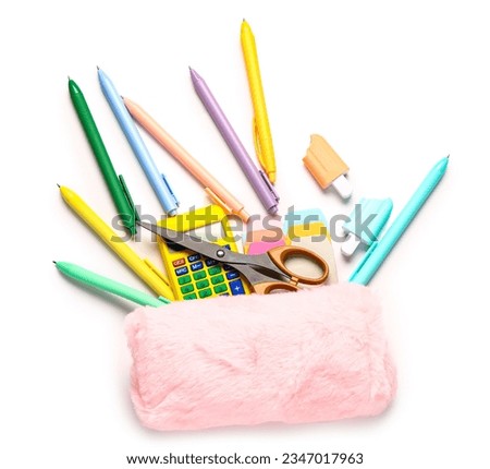 Pink pencil case with different school stationery on white background