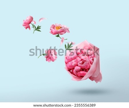Pink peony flowers flying to beautiful bouquet on light blue background