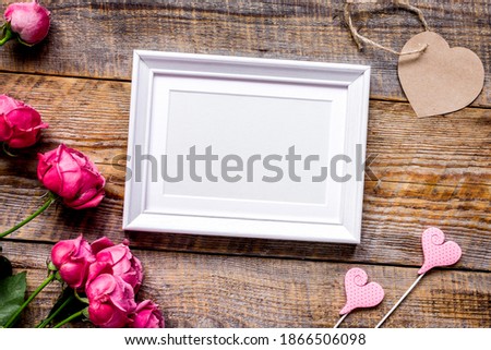 pink peony and frame for present on wooden background top view mockup