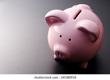 Pink Pig Piggy Bank Close-up On A Dark Background