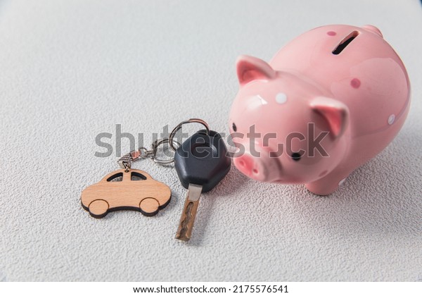 Pink piggy bank and car\
keys\