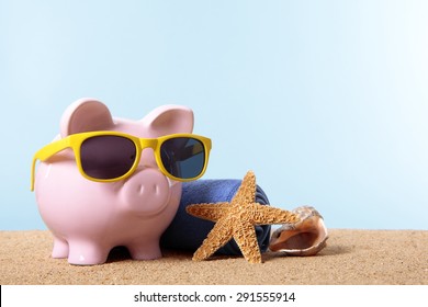 Pink piggy bank on a beach with sunglasses, travel savings concept.