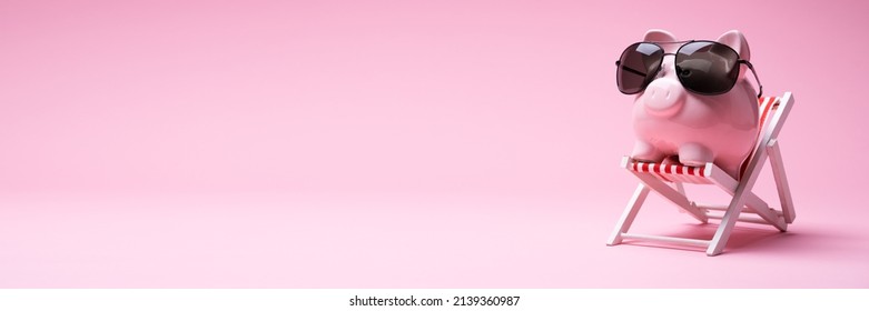 Pink Piggy Bank With Sunglasses On The Small Deck Chair On Pink Background