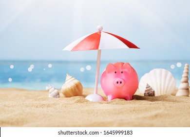 Pink Piggy Bank Under The Small Parasol During Summer At Beach - Powered by Shutterstock