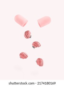 Pink pill with human brains on isolated pastel white background. Brainwashing and mind control idea. Minimal abstract concept of memory, psychology, brain fog, neurology, influence or manipulation.