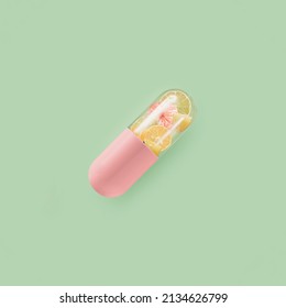 Pink Pill With Lemon, Tangerine, Orange And Lime On Isolated Pastel Green Background. Minimal Pharmaceutical Abstract Concept Of Vitamin C Supplements. Natural Healthy Citrus Source Of Antioxidants.