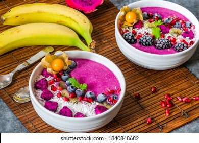 Pink Pitaya Smoothie Bowls With Fruit, Coconut Flakes And Linseed - Healthy Breakfast Idea.