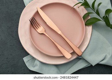 Pink plates and cutlery on black background - Powered by Shutterstock