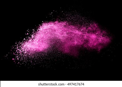 Pink powder explosion on black background. Colored cloud. Colorful dust explode. Paint Holi.