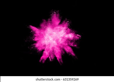 Pink powder explosion on black background. Colored cloud. Colorful dust explode. Paint Holi.