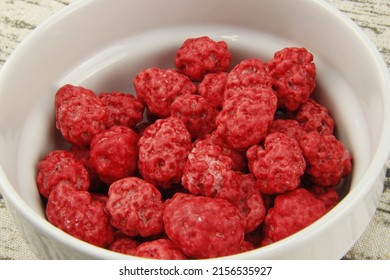 Pink Praline Candies On A Bowl