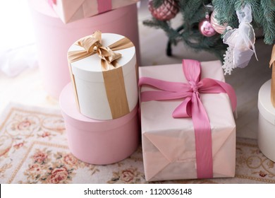 Pink Present Boxes With Ribbons Under The Christmas Tree 