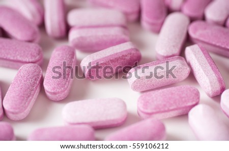 Pink and Purple Bilayer Tablets of Supplements for Sustained Release