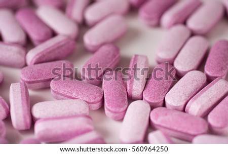 Pink and Purple Bilayer Tablets of Supplements for Sustained Release